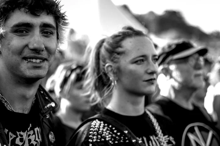 Black-and-white portrait of two young punks in studded jackets in the crowd, Binic Folk Blues Festival 2025